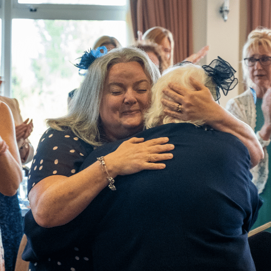 Photo of a celebratory hug 